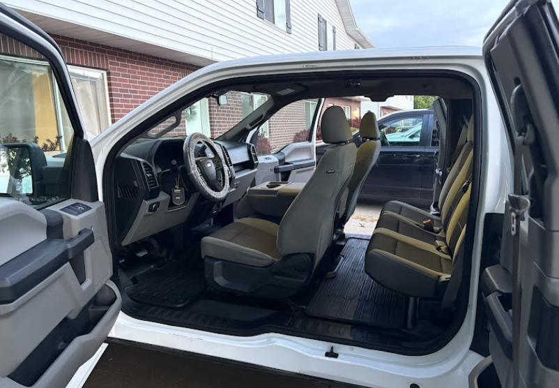 Clean truck interior with doors open after an interior detail in Orem, Utah